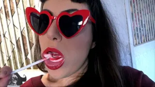 Lollipop sucking and heart-shaped glasses