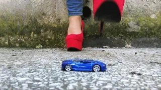 Trying my red high heels on lil toy car