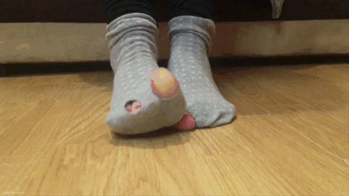 SMALL FEET IN WORN RIPPED STINKY HOLEY SOCKS