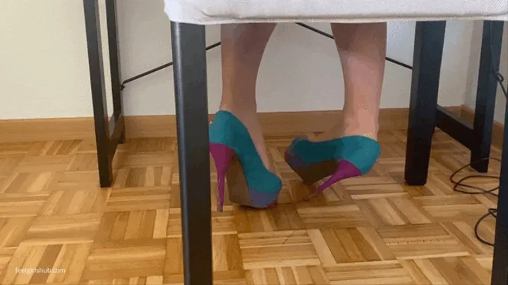 VERY SORE NYLON FEET IN HEEL HEELS RELAXING ON OFFICE DESK