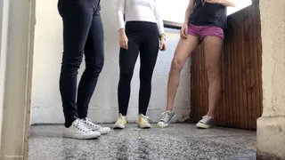 GIRLS CRUSHING CIGARETTES IN DIFFERENT SHOES
