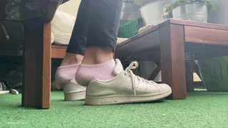 STEPPING ON THE BACK OF OLD SNEAKERS
