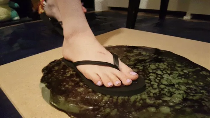 Janet Stuck in Black Flip Flops Stuck in Glue