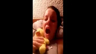 Tired brunette yawning and hugging my duck plush
