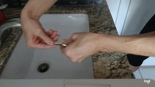 Nail Filing Over Bathroom Sink