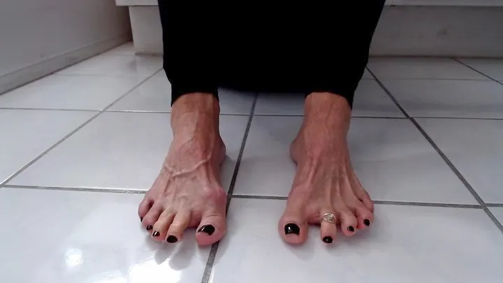 Toe Wiggling With Garnet Toenail Polish