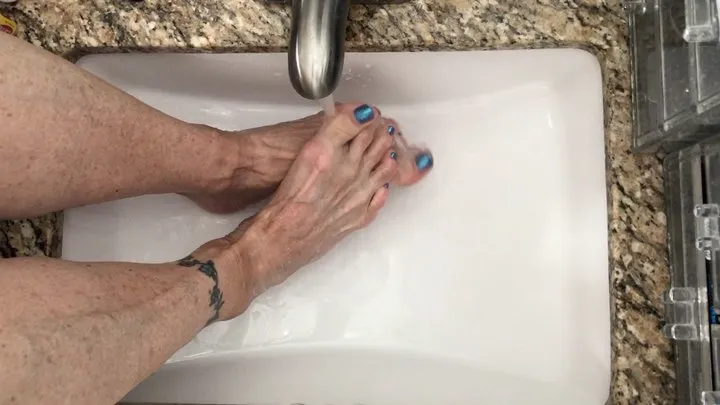 Feet Under Running Water