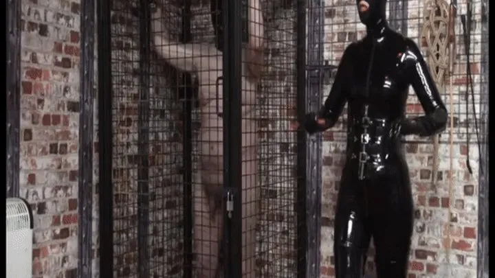 Caged and Spat On By Rubber Clad Mistress