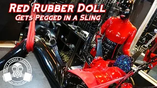 Red Rubber Doll Gets Pegged in Sling