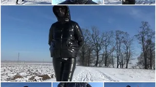 Winter walk in a PVC down jacket and handcuffs (hands back)