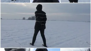 Snow walk in a down jacket and ropes