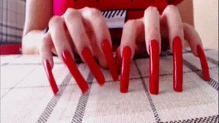 red nails scratching pillow