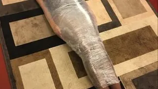 MAGICIANS ASSISTANT GETS SHRINK WRAPPED INTO A NEW TRICK. BONDAGE