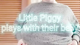 Little Piggy plays with their belly