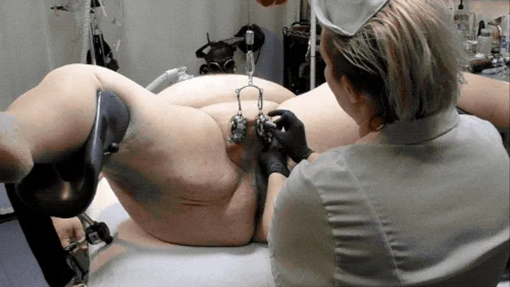 The patient's scrotum is compressed, stretched and spiked