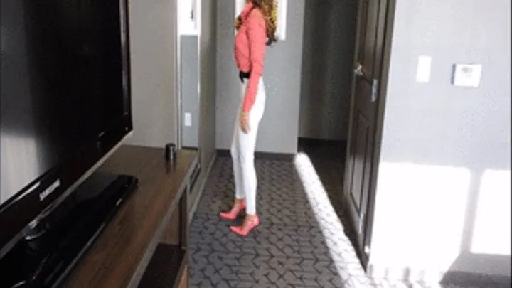 Chloe wearing skintight white jeans and heels