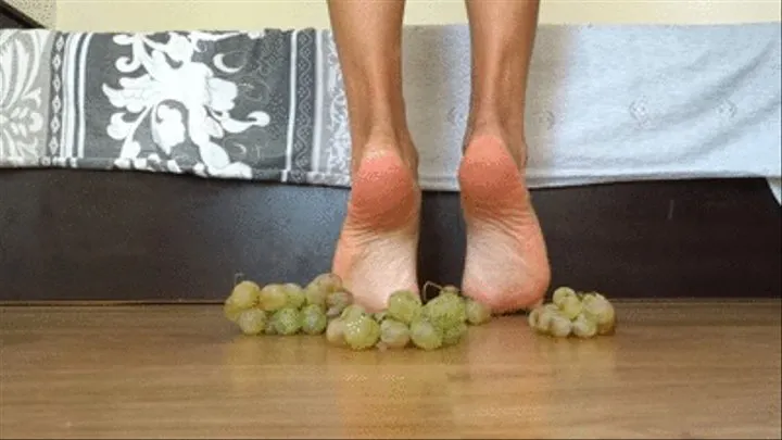 Crushing grapes barefoot - very close view