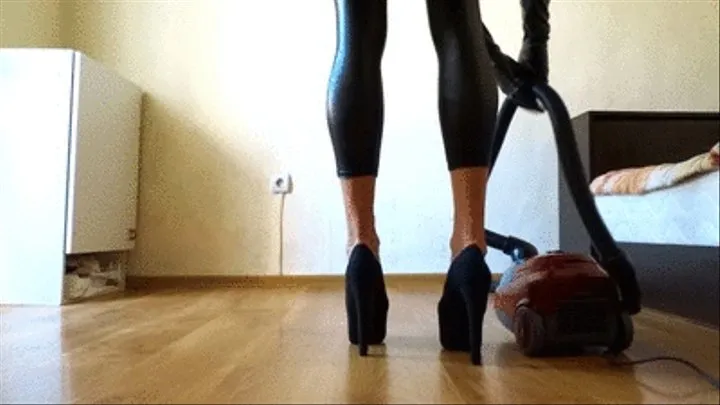 Vacuuming in latex costume and black 6.5 inch pumps