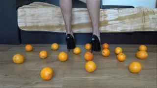 Crushing oranges and making fresh juice with my black stiletto high heels