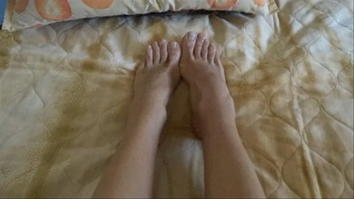 Showing my sexy feet and toes while relaxing on the bed - pov view