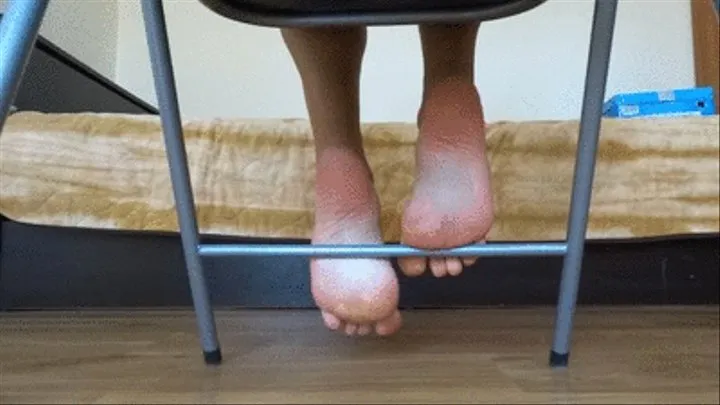 Playing with feet under the chair - bottom view of my sexy soft soles