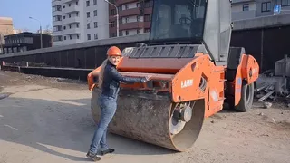 Katya In Helmet And Road Roller