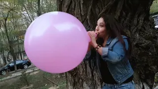 Nathalie Blows To Pop Pink Balloon Outdoor