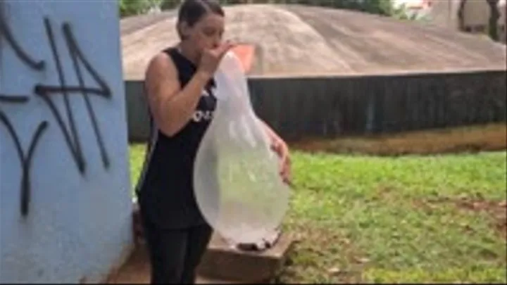 Jane Blows to Pop a Clear Balloon