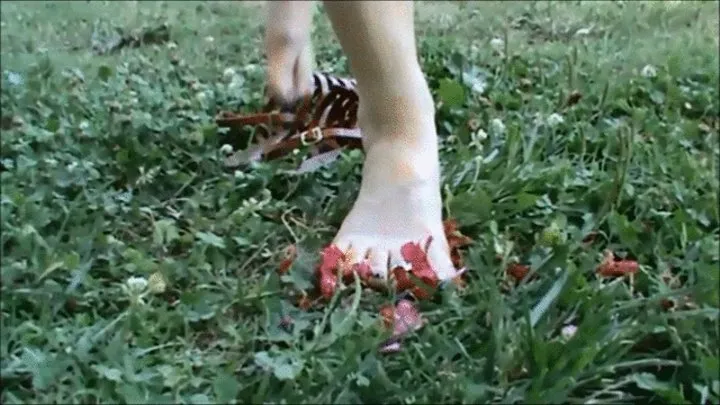 She colors her feet with pink flowers