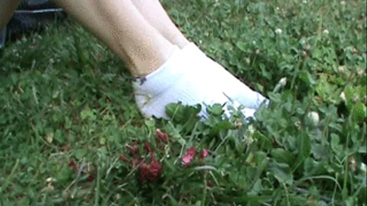 French girl in socks rub grass