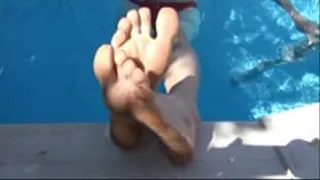 He films my small feet and wrinkled soles while i'm chilling in a swimming pool