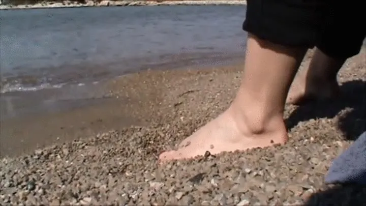 Christine is playing with wet sand