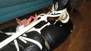 Lauri gets hogtied in tight leather pt 2