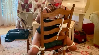 Tied Talette 4 from Bondage Agency-Blake LaVista is bound tight sitting backwards on a chair with red ballgag