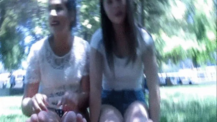 2 Girls barefoot on a park