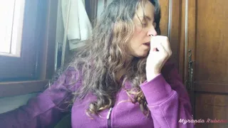 Sneezing wearing a purple sweater