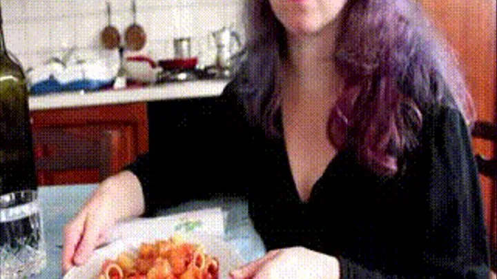 Eating pasta.