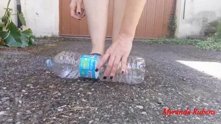 Crushing plastic bottles with slippers.
