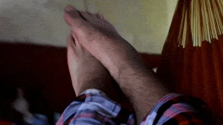 Feet relaxed in a hammock