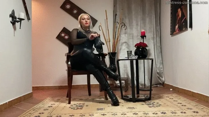 LEATHER GODDESS SMOKING A CIGARETTE