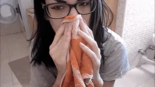 Nose blowing in a towel