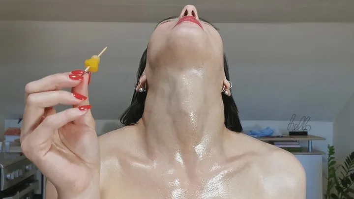 oiled neck stretching and fruit swallowing