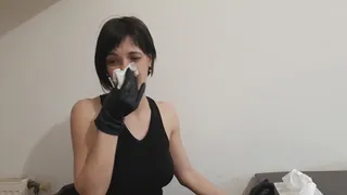 Nose blowing in black leather gloves