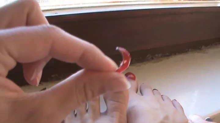 clipping red toenails