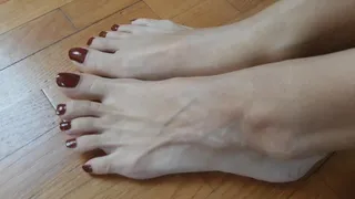long toenails and dark red polish