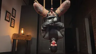 Inverted Straitjacket Suspension - Heavy and Elise Graves - Elise straps Heavy into a sexy leather SJ, ballet boots and hood before suspending them upside down with an intense ball tie!