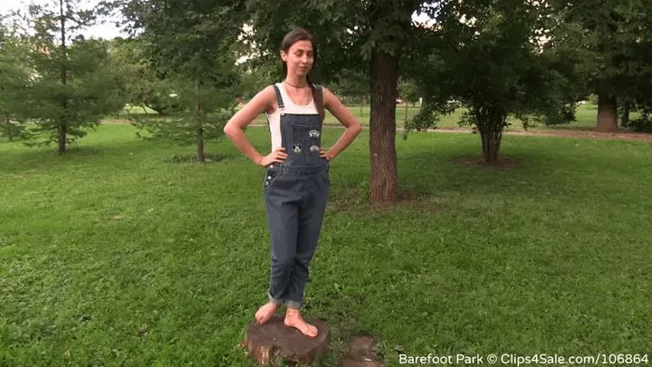 Sports girl Madlena in denim overalls in the city meadow (Part 6 of 6)