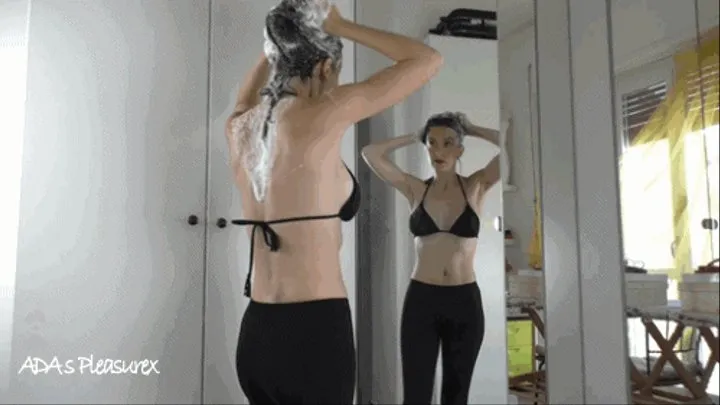 Standing at the mirror hair washing