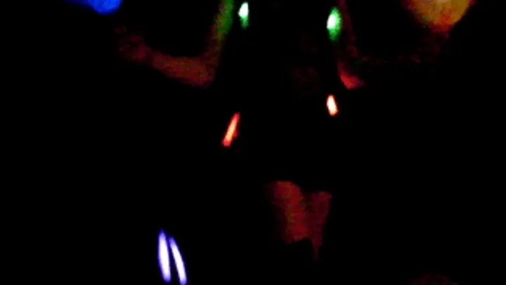 wildcat dancing in the dark with light sticks