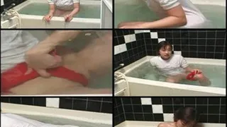 Fully clothed schoolgirl soaked in tub!